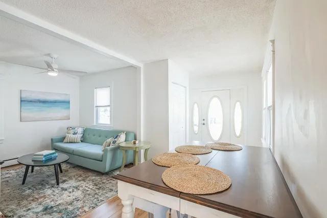 a living room with furniture and a table