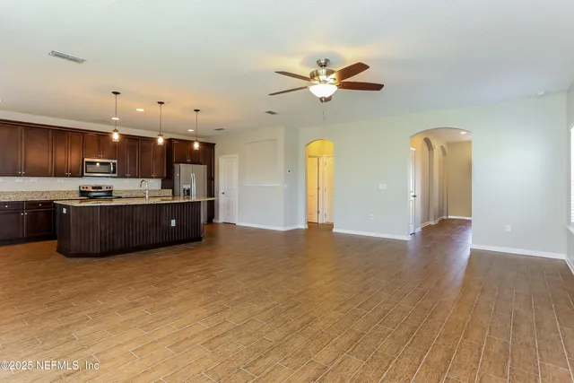 a view of kitchen with cabinets and wooden floor