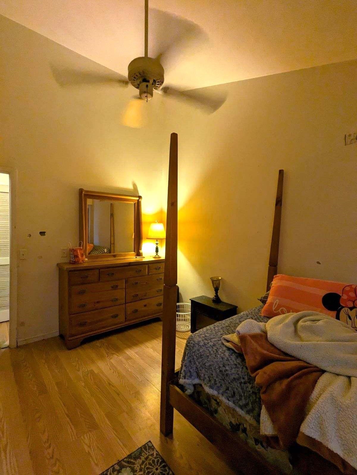 1112 Blue Ridge Drive, Unit 9 Harrisonburg, VA 22802 - Photo 13 of 13 a bedroom with a bed and wooden floor