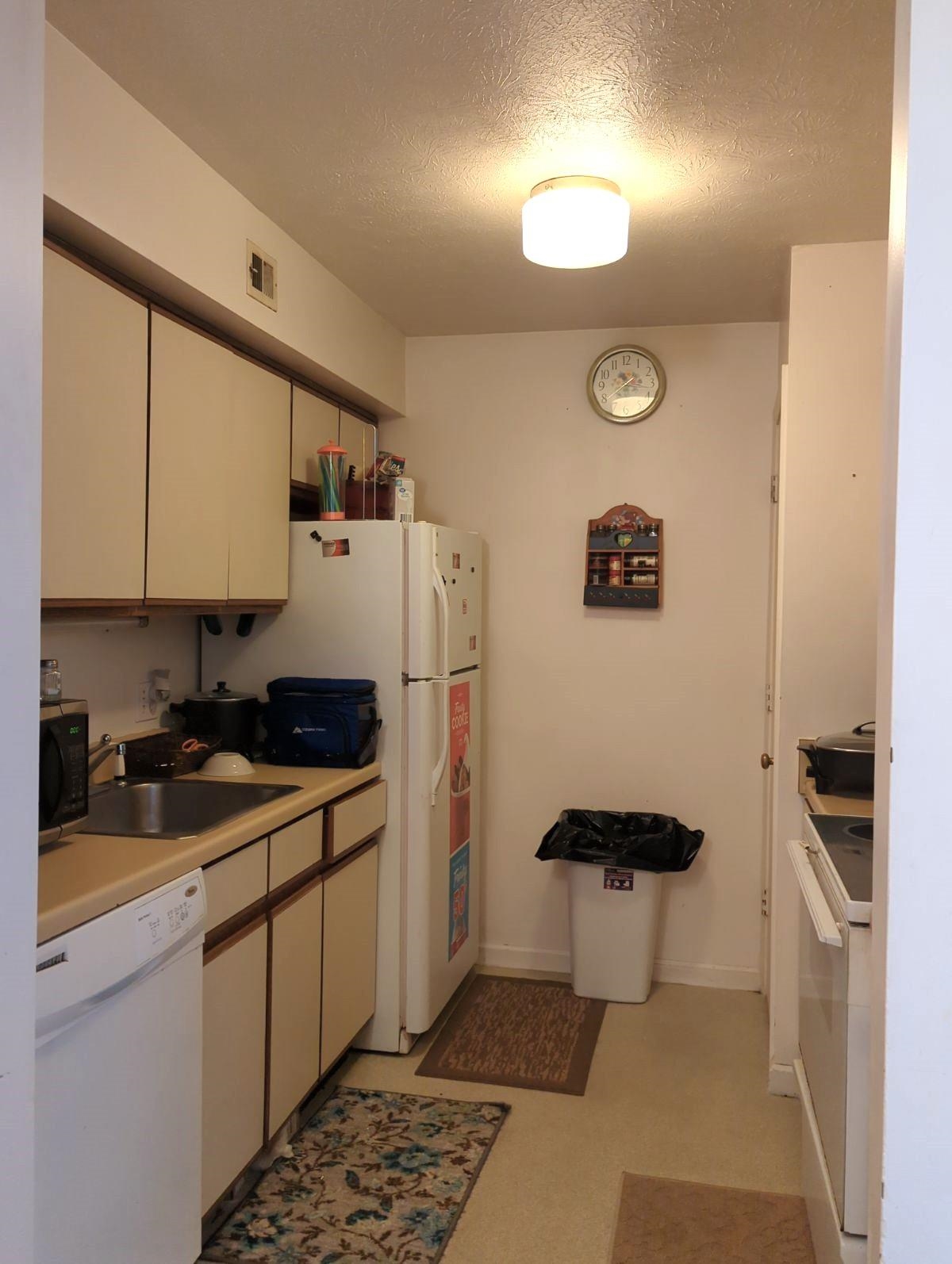 1112 Blue Ridge Drive, Unit 9 Harrisonburg, VA 22802 - Photo 6 of 13 a kitchen with a refrigerator and a stove top oven