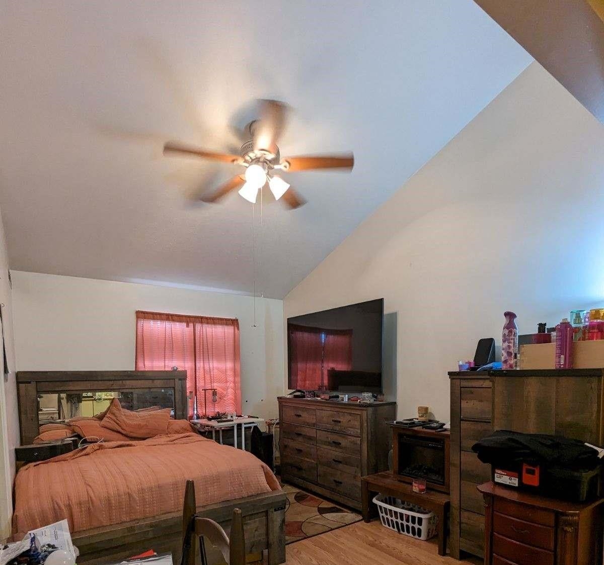 1112 Blue Ridge Drive, Unit 9 Harrisonburg, VA 22802 - Photo 9 of 13 a bedroom with a bed and a flat screen tv