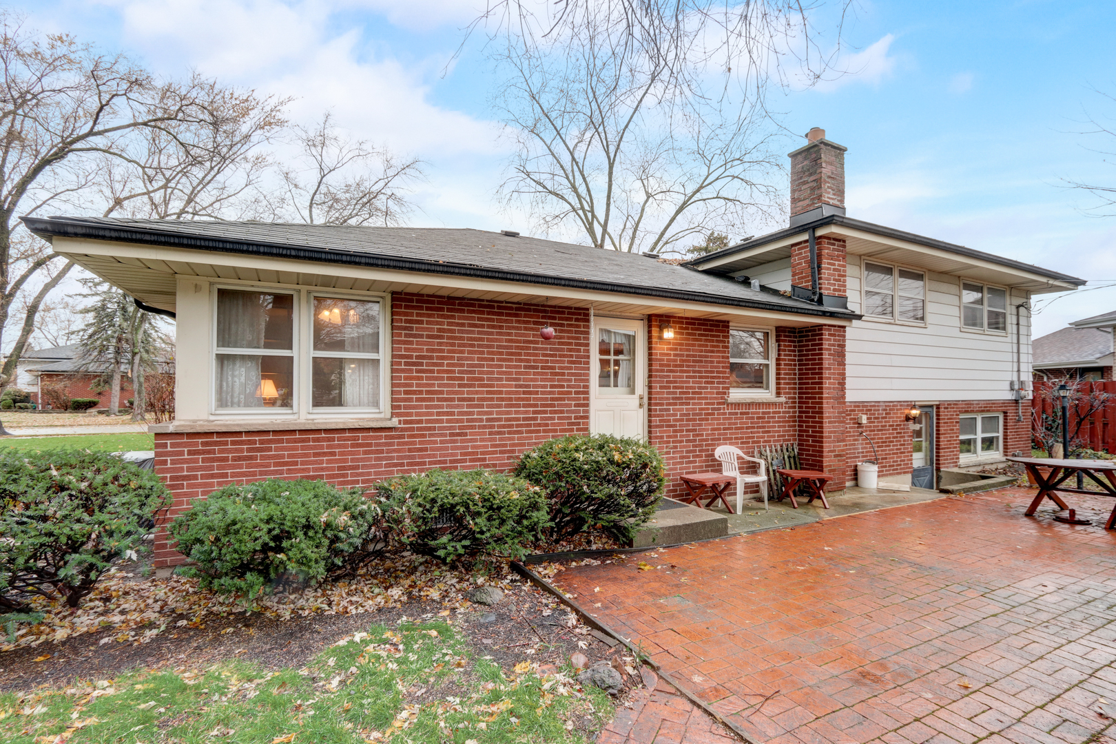 547 Park Place Addison, IL 60101 - Photo 19 of 30 a front view of a house with a yard and potted plants