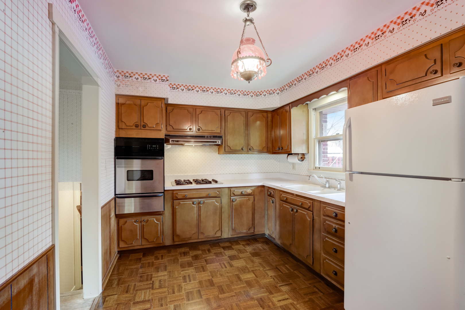 547 Park Place Addison, IL 60101 - Photo 8 of 30 a kitchen with stainless steel appliances granite countertop a refrigerator a sink dishwasher a stove top oven a sink and dishwasher