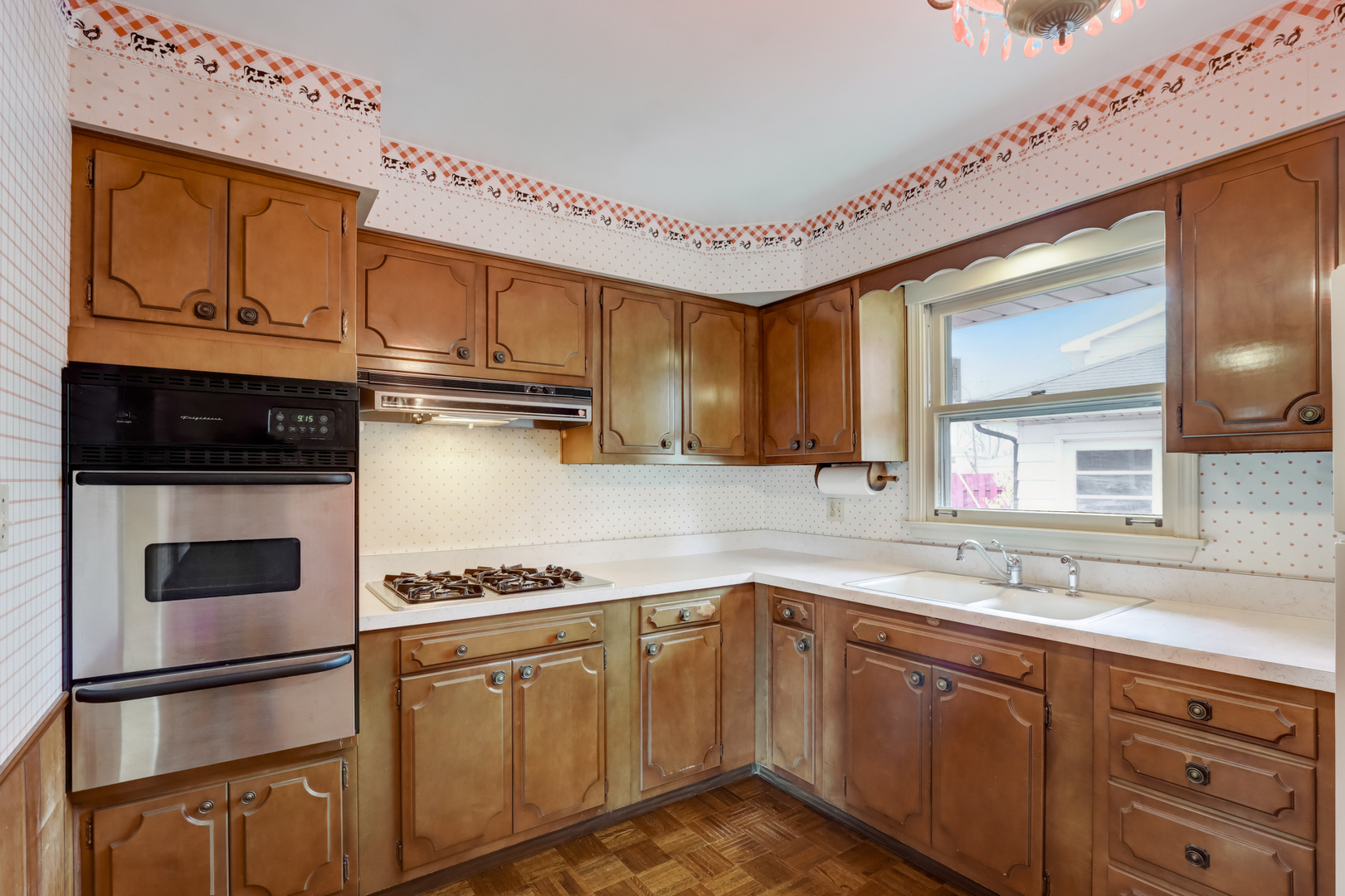 547 Park Place Addison, IL 60101 - Photo 10 of 30 a kitchen with cabinets and window