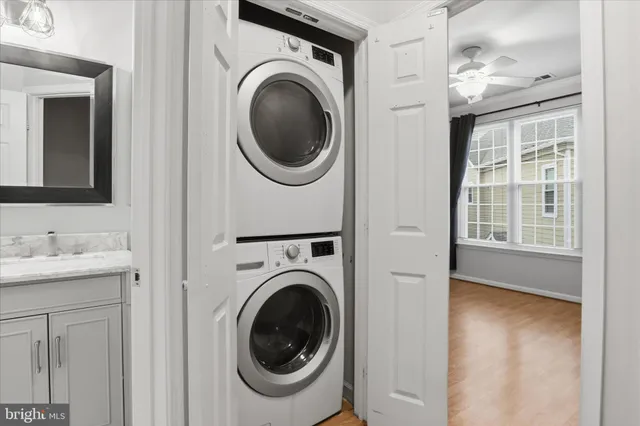 a view of a hallway with washer and dryer