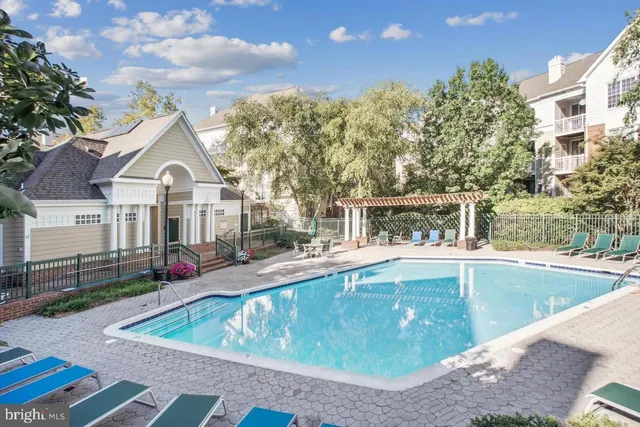 a view of a white house with a yard