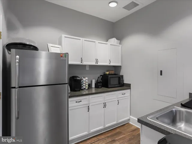 a sign that is sitting on a wooden floor