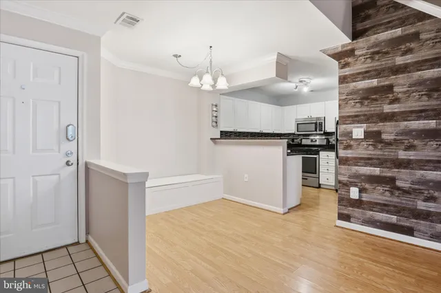 a kitchen with granite countertop a stove and a refrigerator
