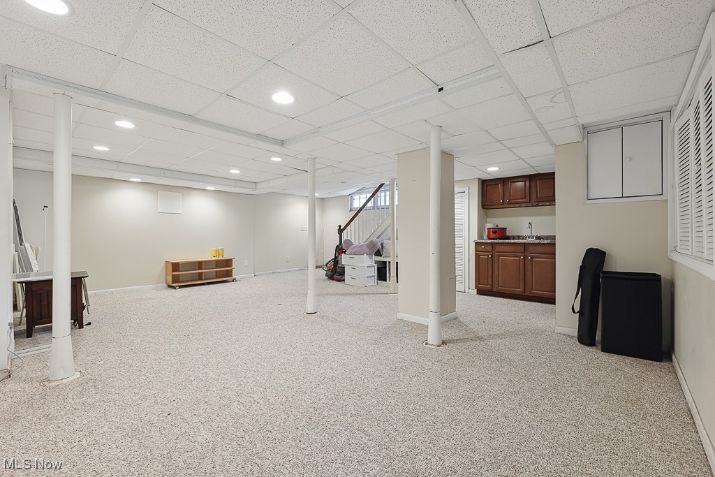 3266 Avalon Road Cleveland, OH 44120 - Photo 45 of 46 Below grade area featuring a drop ceiling, carpet flooring, recessed lighting, and bar area
