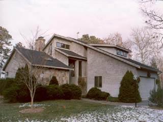 Undisclosed Address Brewster, MA 02631 - Photo 2 of 2 a view of a house with a yard