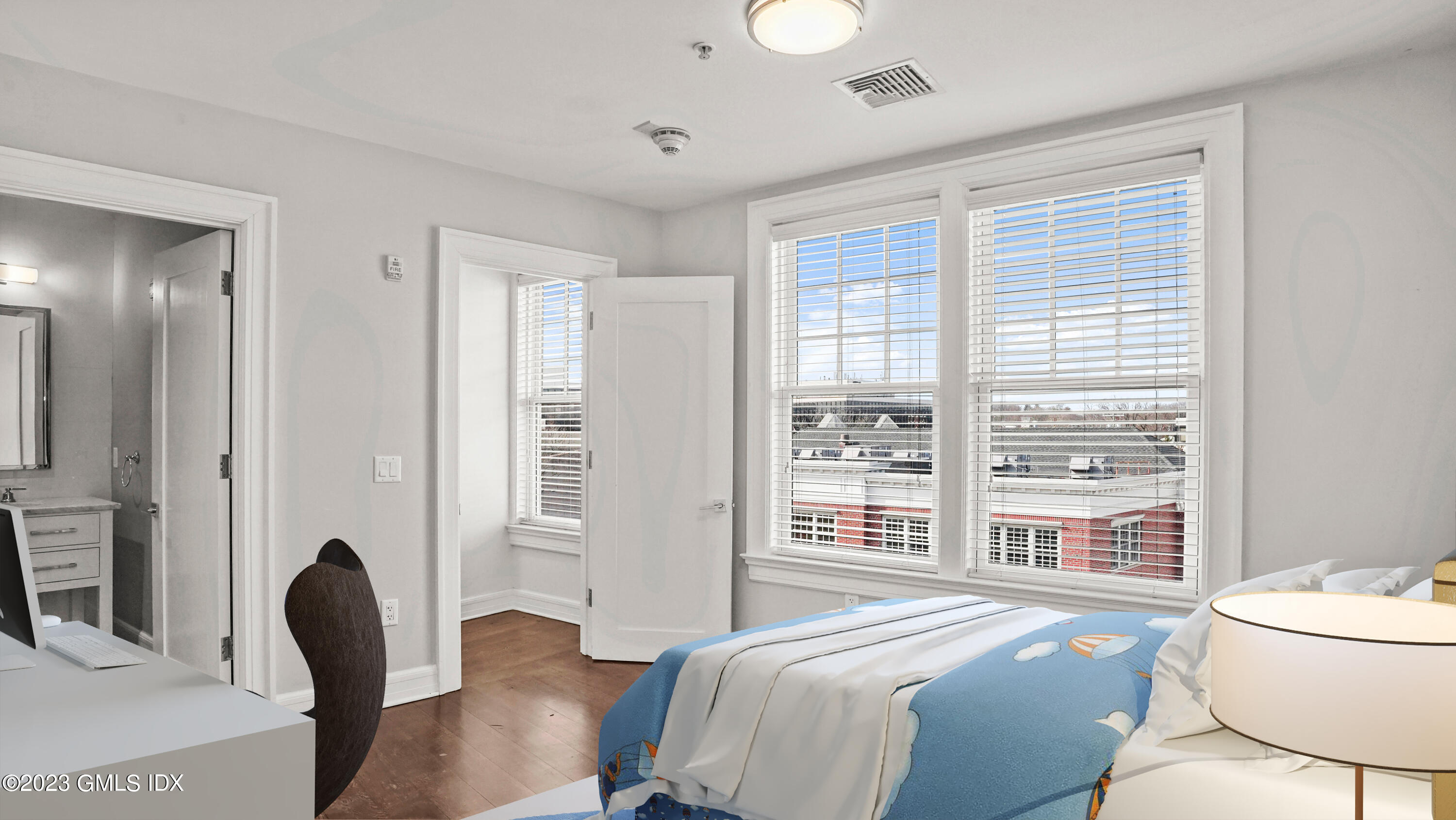 409 Greenwich Avenue, Unit A Greenwich, CT 06830 - Photo 11 of 17 a bedroom with a bed and a chair with the outer view