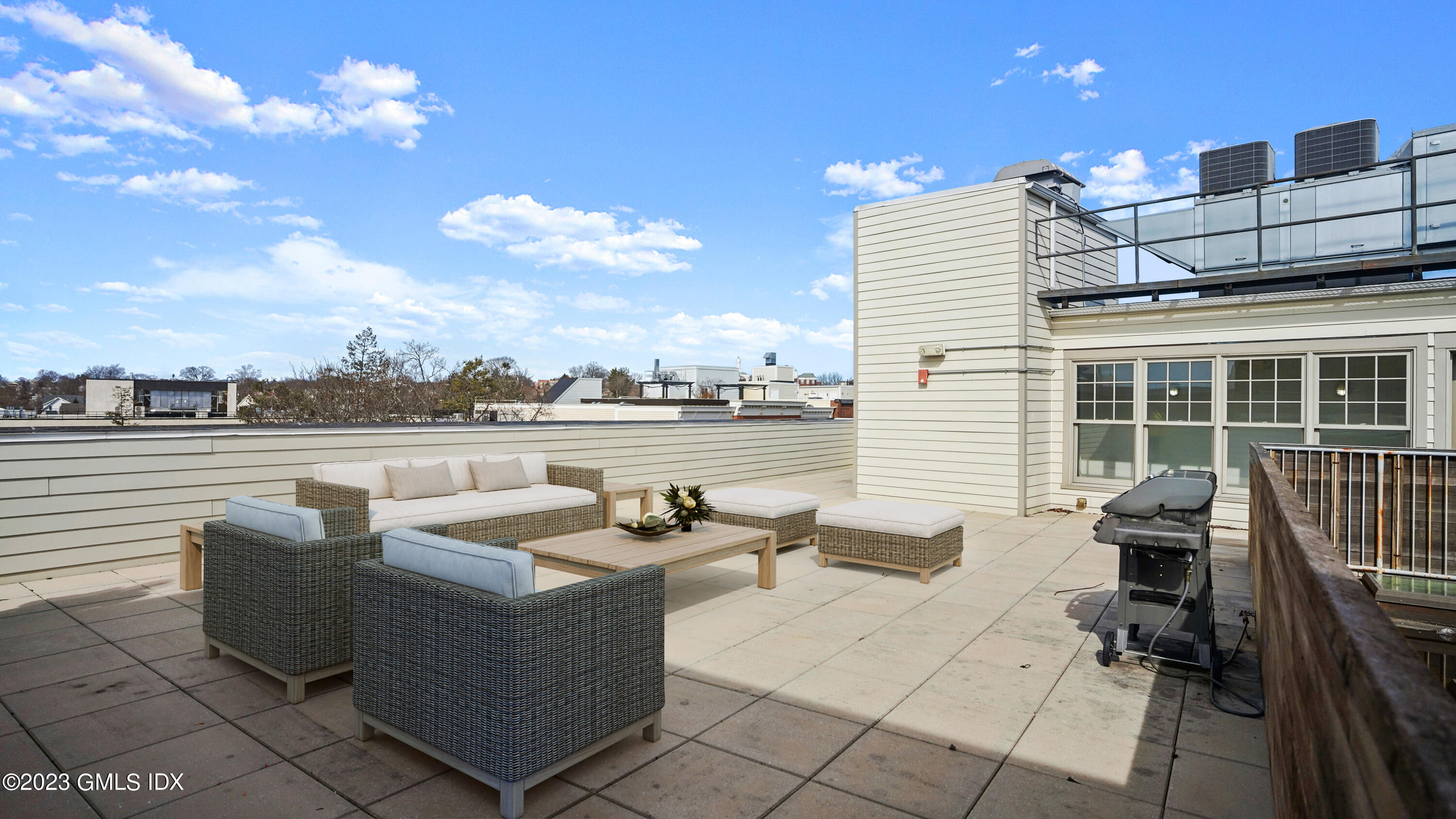 409 Greenwich Avenue, Unit A Greenwich, CT 06830 - Photo 13 of 17 a view of a roof deck with couches and potted plants