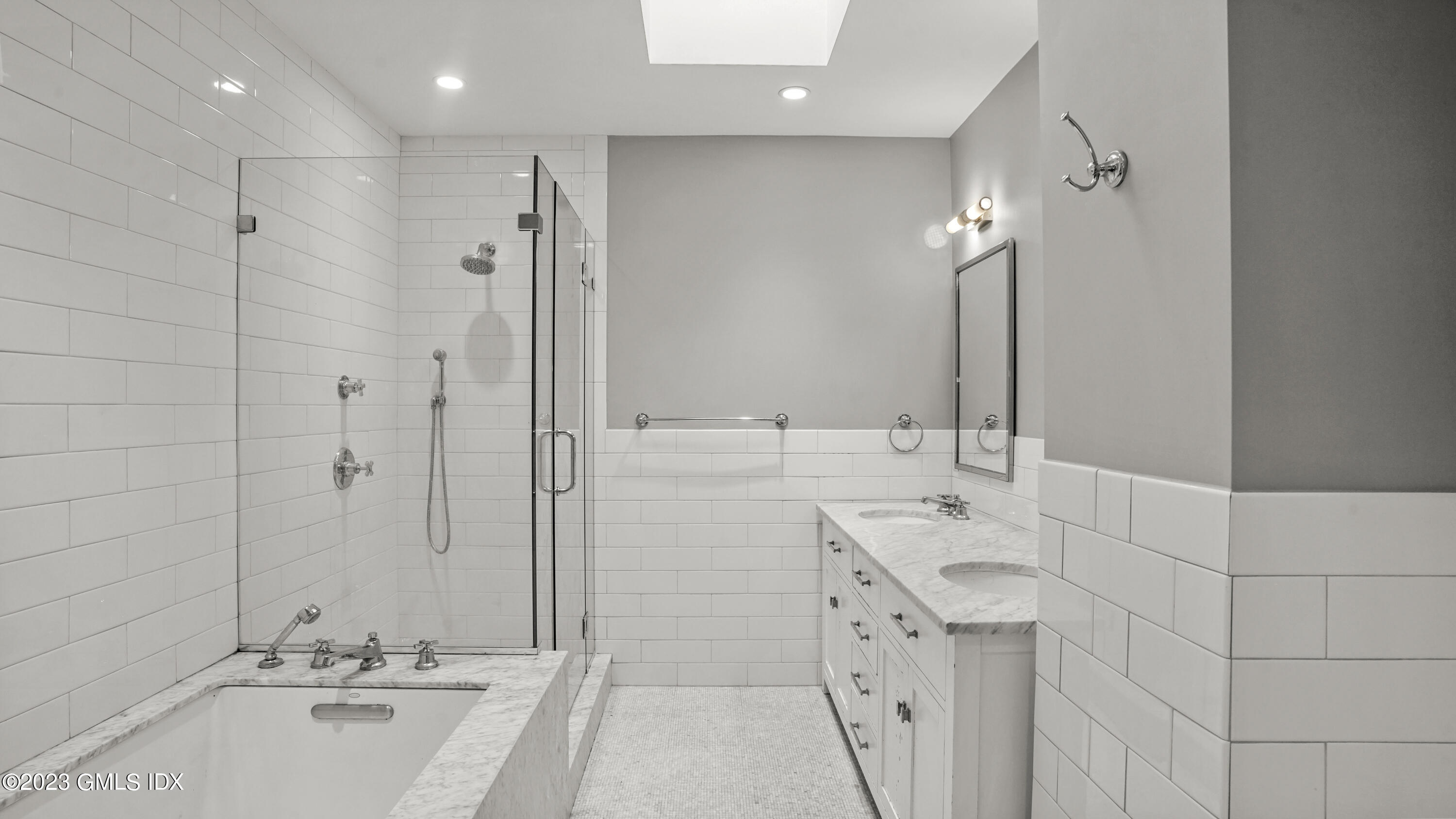 409 Greenwich Avenue, Unit A Greenwich, CT 06830 - Photo 8 of 17 a bathroom with a tub sink and mirror