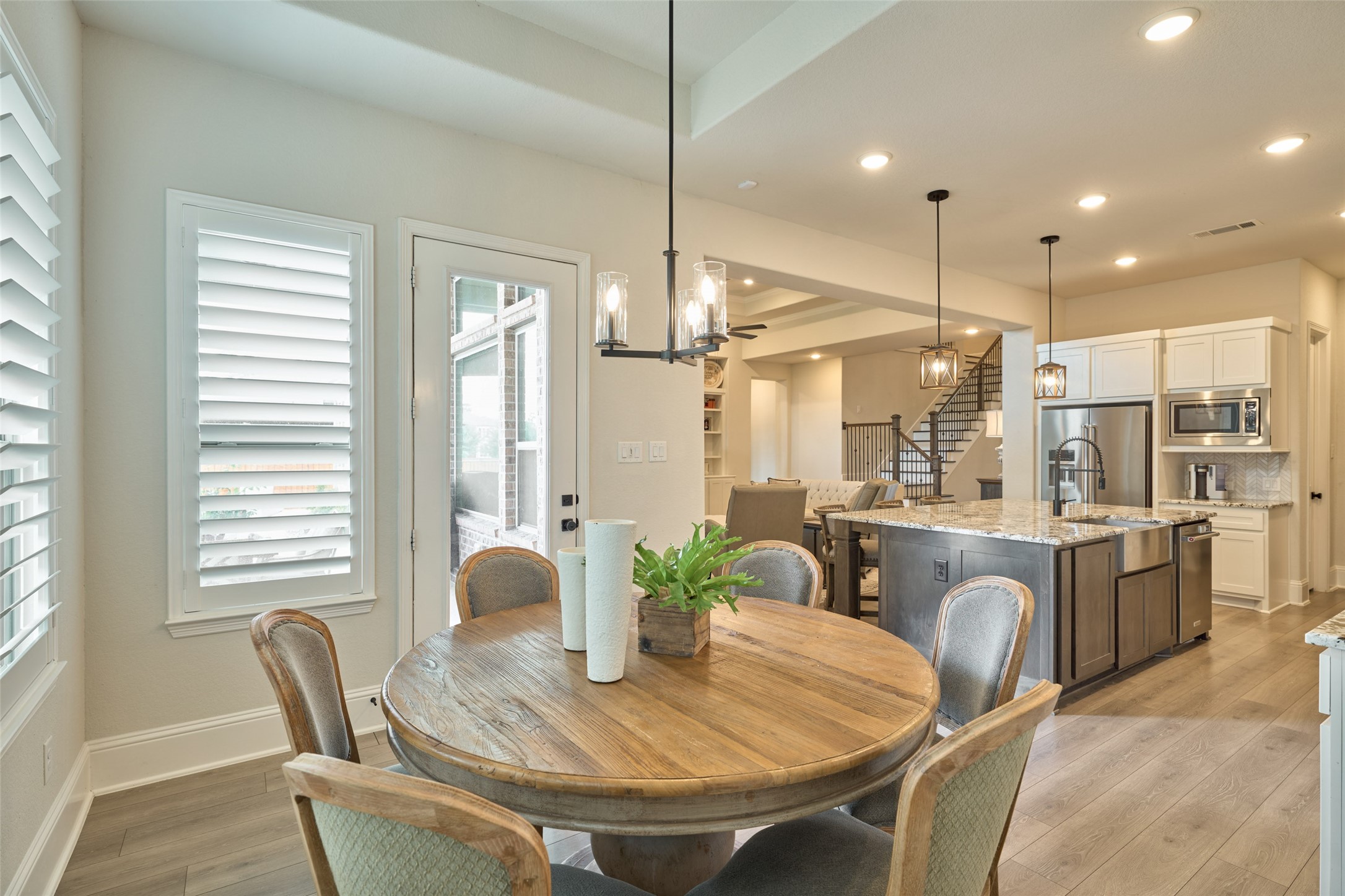 10090 South Goshawk Trail Conroe, TX 77385 - Photo 18 of 43 Breakfast room offers views to the beautiful backyard, pool, and lake.
