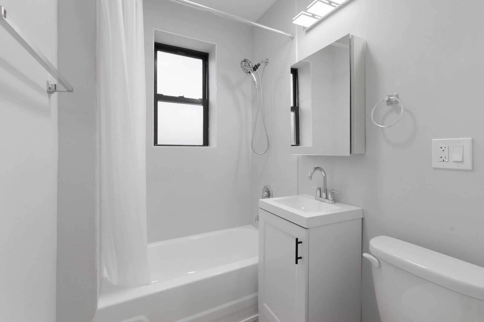 1634 West Howard Street, Unit 202 Chicago, IL 60626 - Photo 7 of 7 a bathroom with a sink toilet and shower
