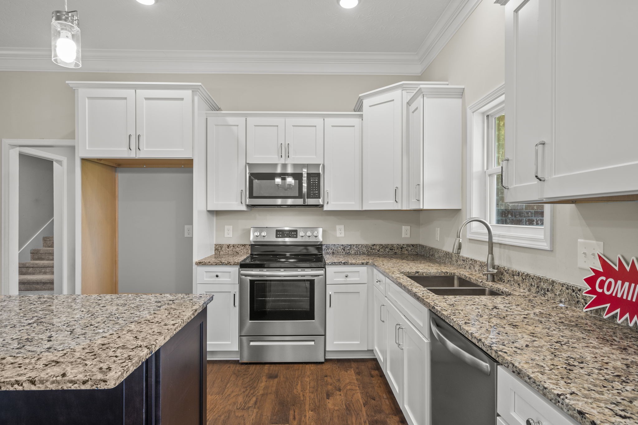 5718 Hoods Branch Road Springfield, TN 37172 - Photo 13 of 47 a kitchen with granite countertop a sink stove and cabinets