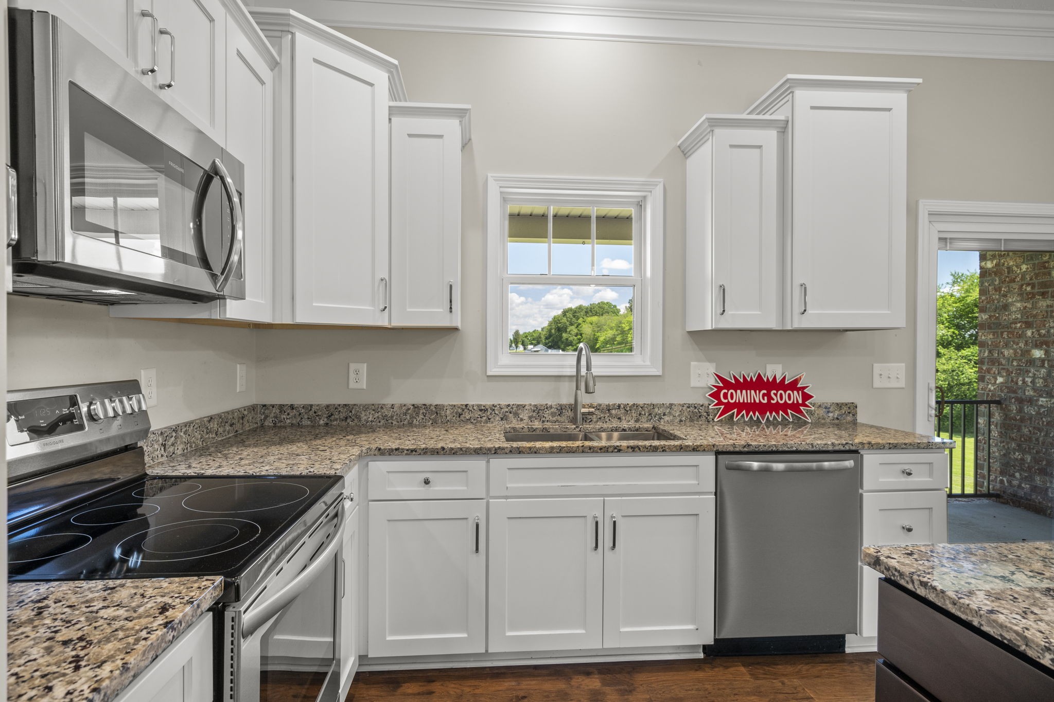 5718 Hoods Branch Road Springfield, TN 37172 - Photo 14 of 47 a kitchen with granite countertop a sink stove and cabinets