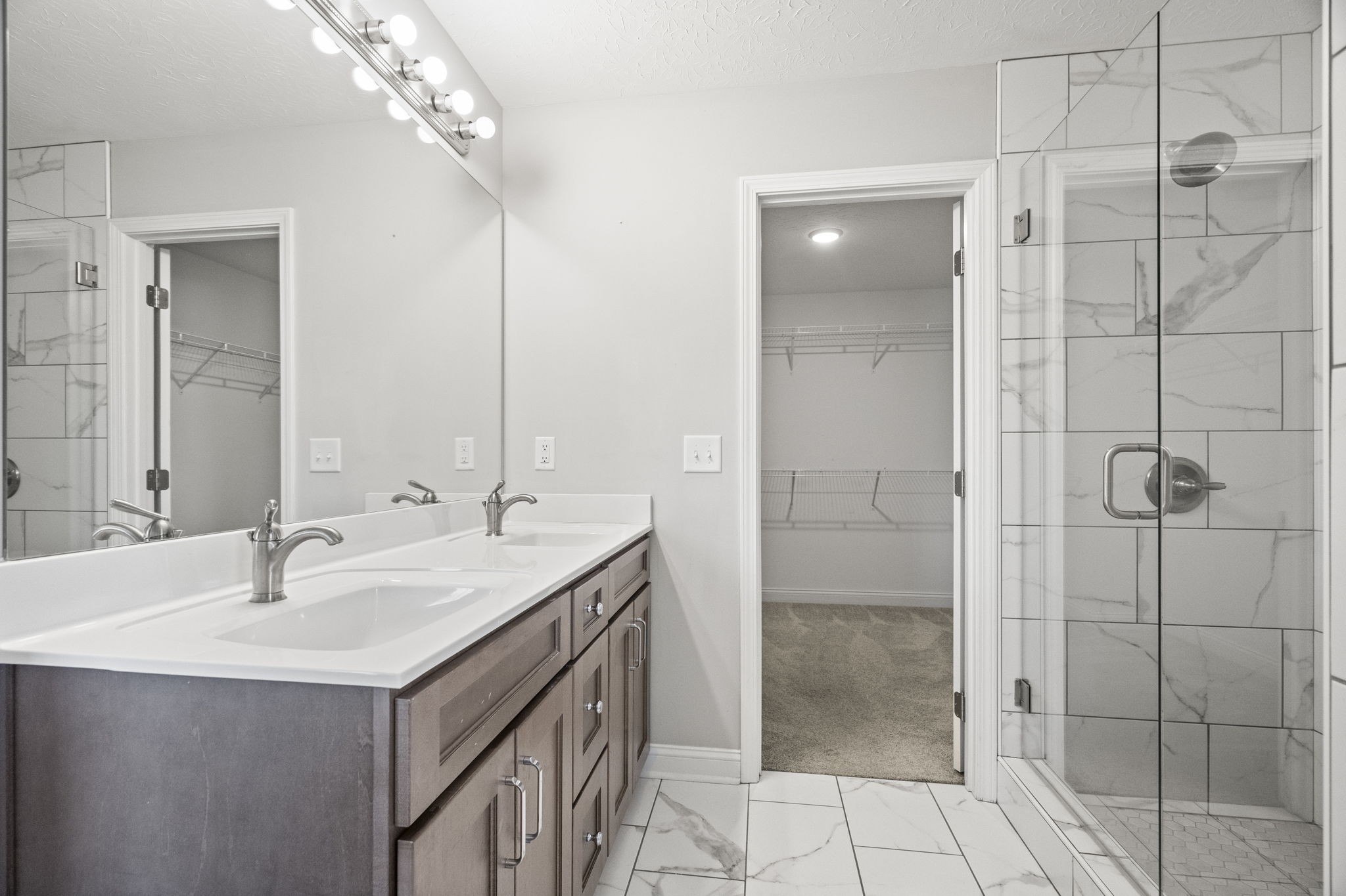 5718 Hoods Branch Road Springfield, TN 37172 - Photo 27 of 47 a bathroom with a double vanity sink a shower and a mirror