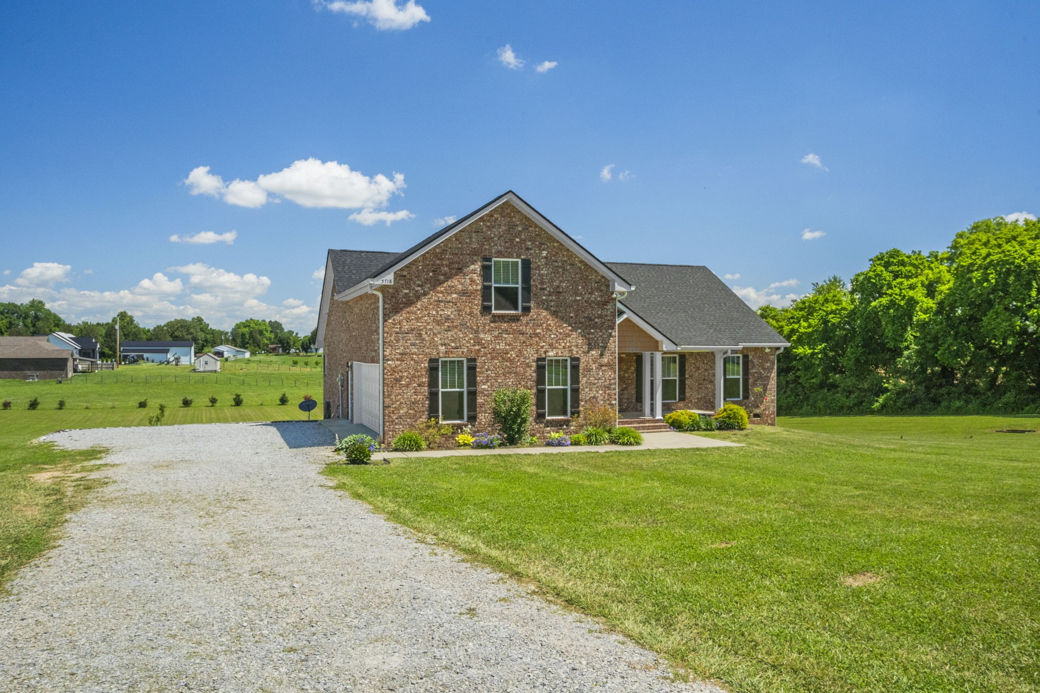 5718 Hoods Branch Road Springfield, TN 37172 - Photo 4 of 47 a front view of a house with a yard and trees
