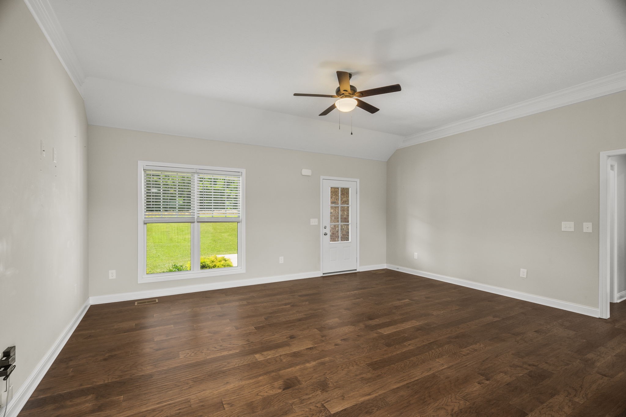 5718 Hoods Branch Road Springfield, TN 37172 - Photo 7 of 47 a view of an empty room with a window and wooden floor