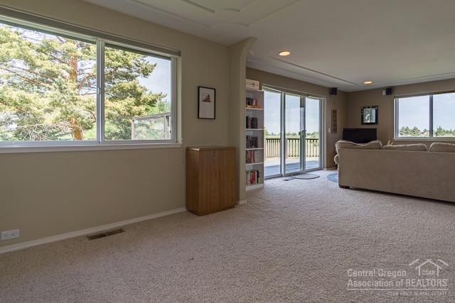 22522 Rickard Road Bend, OR 97702 - Photo 13 of 23 a living room with furniture and a large window