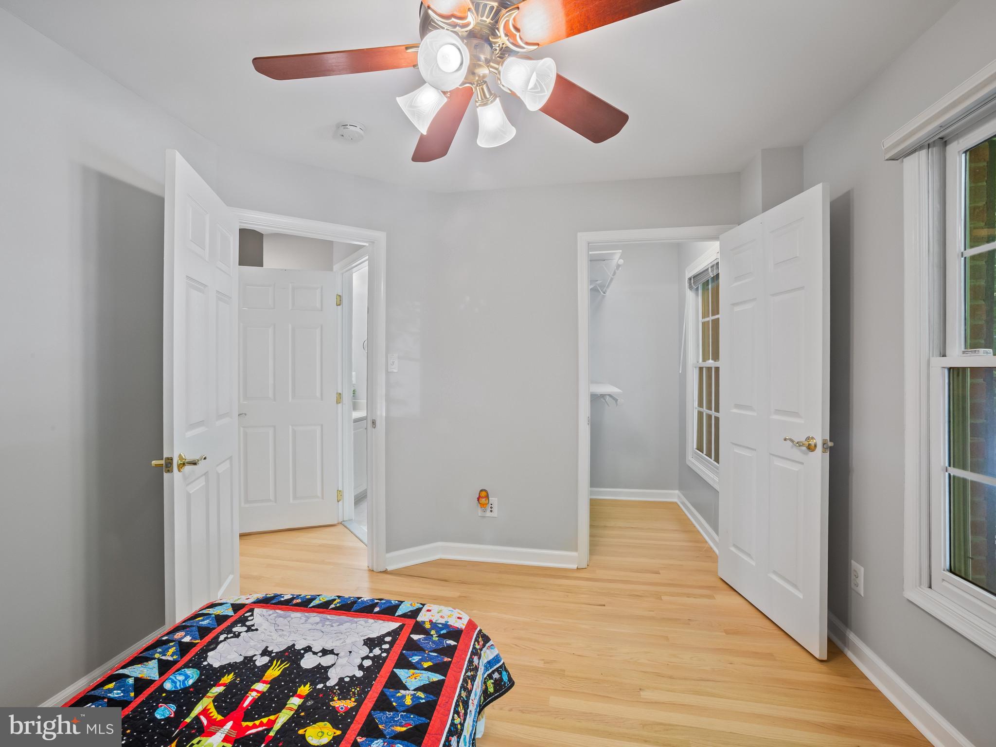 8511 Cameron Street Silver Spring, MD 20910 - Photo 18 of 39 a bedroom with a bed and a chandelier