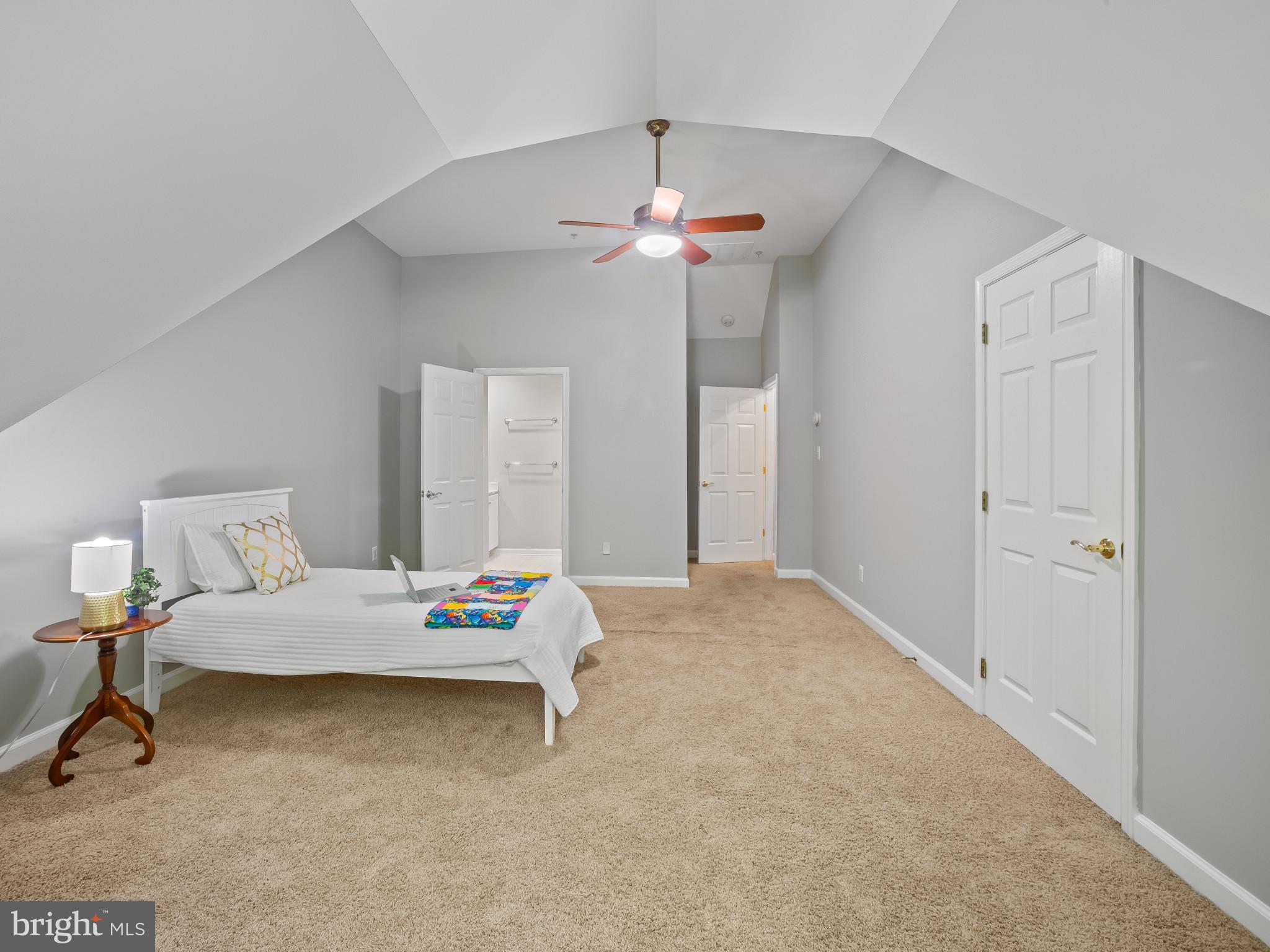8511 Cameron Street Silver Spring, MD 20910 - Photo 20 of 39 a bedroom with a bed and a chandelier