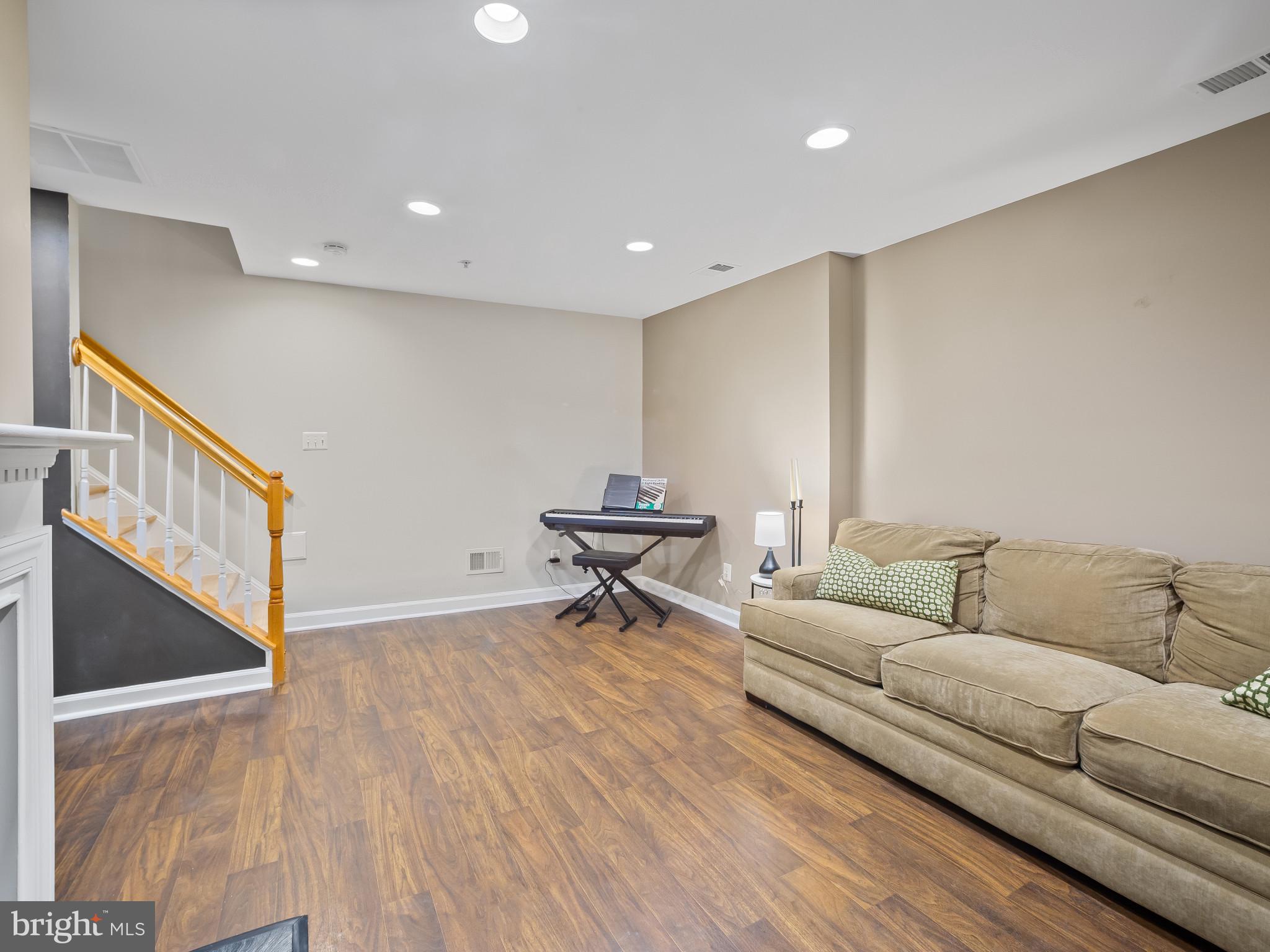 8511 Cameron Street Silver Spring, MD 20910 - Photo 26 of 39 a living room with furniture and a ceiling fan