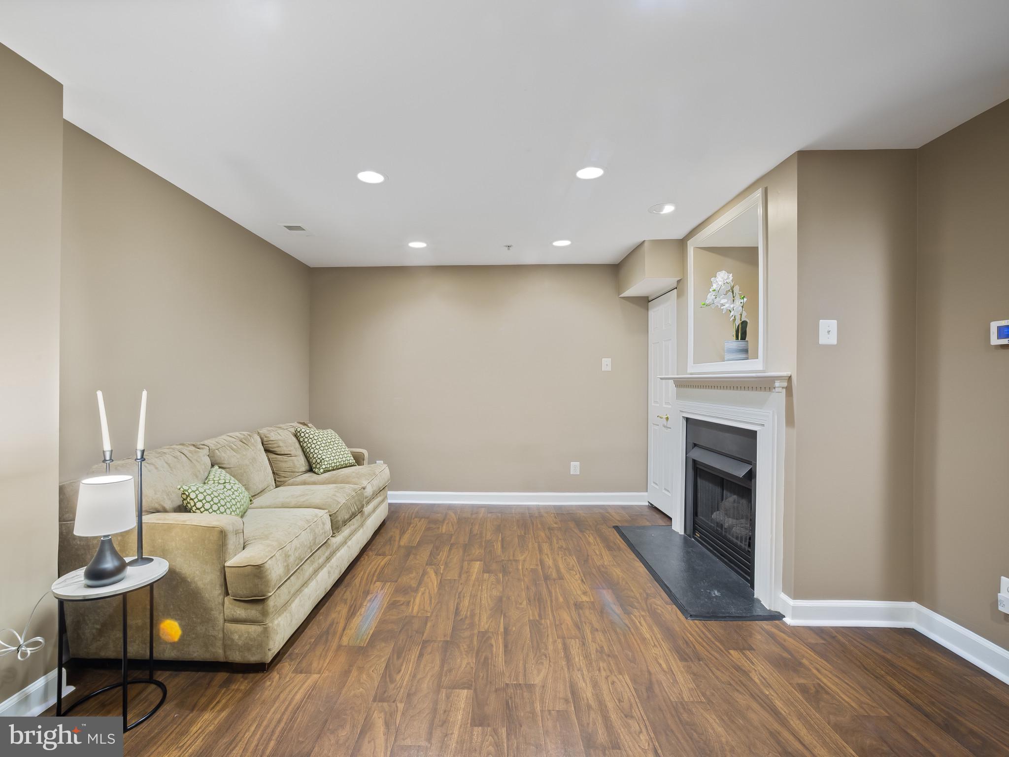 8511 Cameron Street Silver Spring, MD 20910 - Photo 28 of 39 a living room with furniture and a fireplace