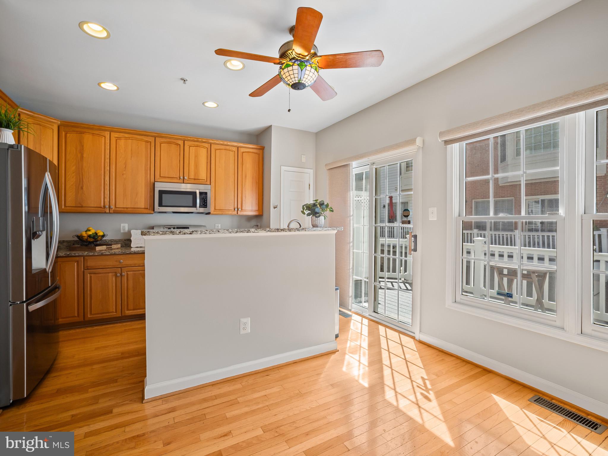 8511 Cameron Street Silver Spring, MD 20910 - Photo 6 of 39 a kitchen with stainless steel appliances granite countertop a stove a sink a refrigerator white cabinets and a refrigerator