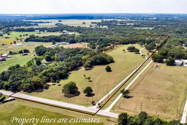 an aerial view of residential house with outdoor space