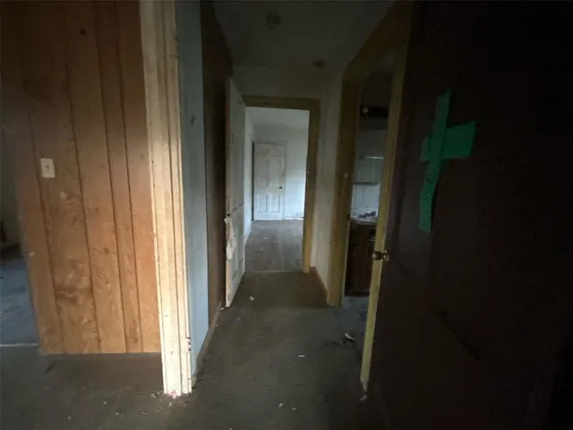 a view of a hallway with seating area