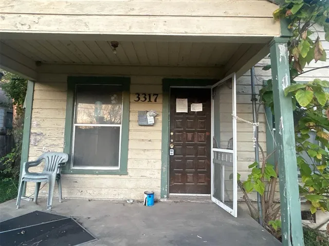 a front view of a house with a garage