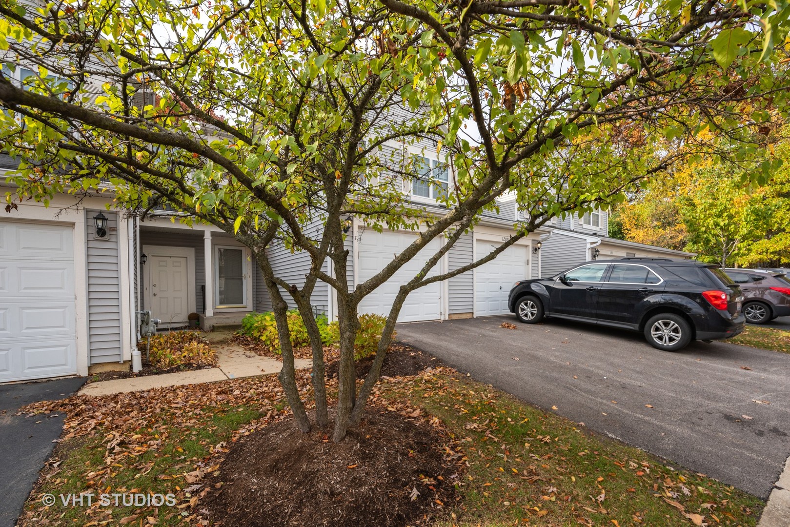 1207 Brookdale Drive Carpentersville, IL 60110 - Photo 2 of 14 a car parked in front of a house