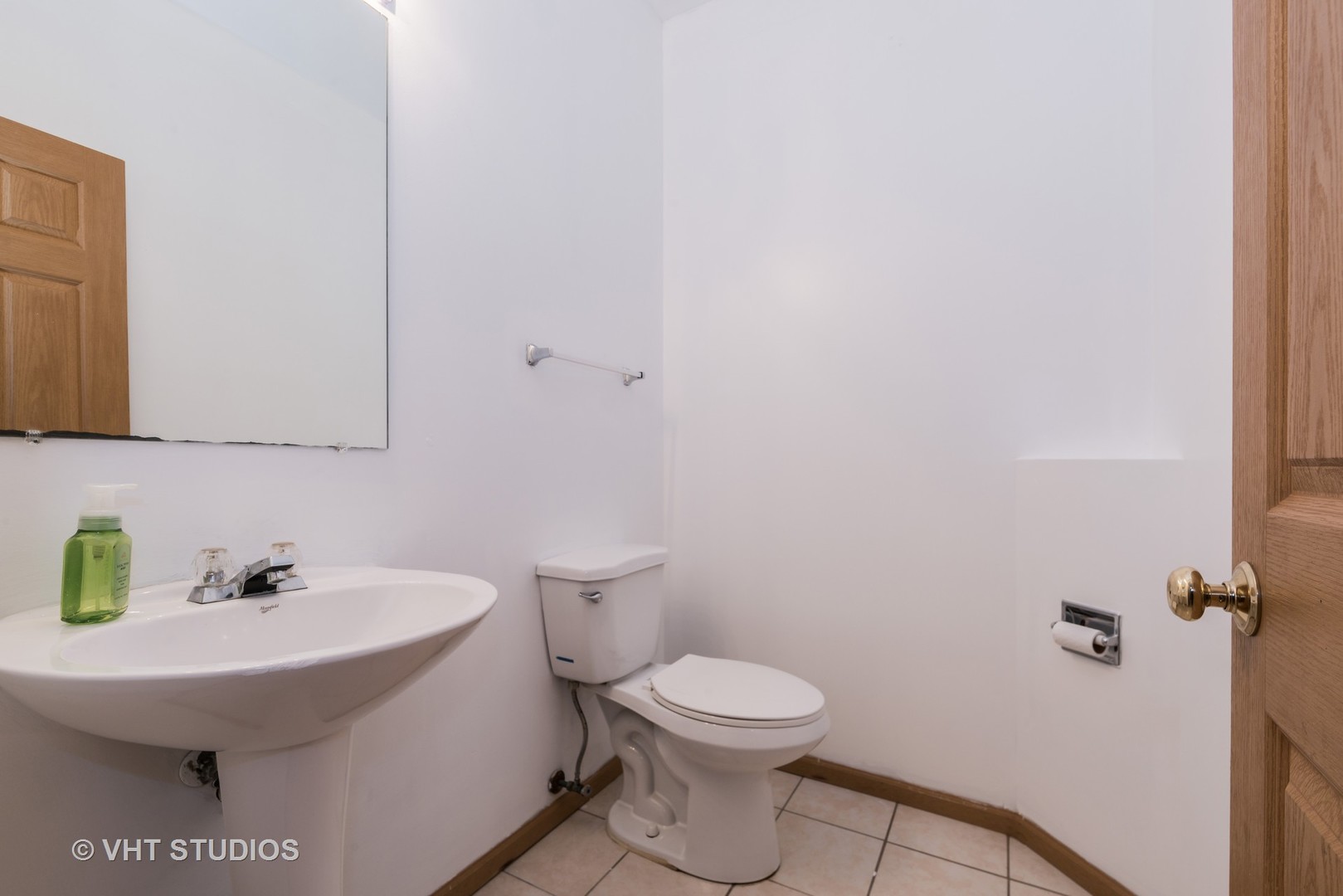 1207 Brookdale Drive Carpentersville, IL 60110 - Photo 11 of 14 a bathroom with a sink and a toilet