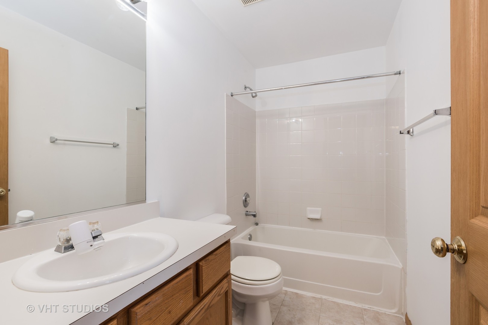 1207 Brookdale Drive Carpentersville, IL 60110 - Photo 12 of 14 a bathroom with a sink toilet and shower