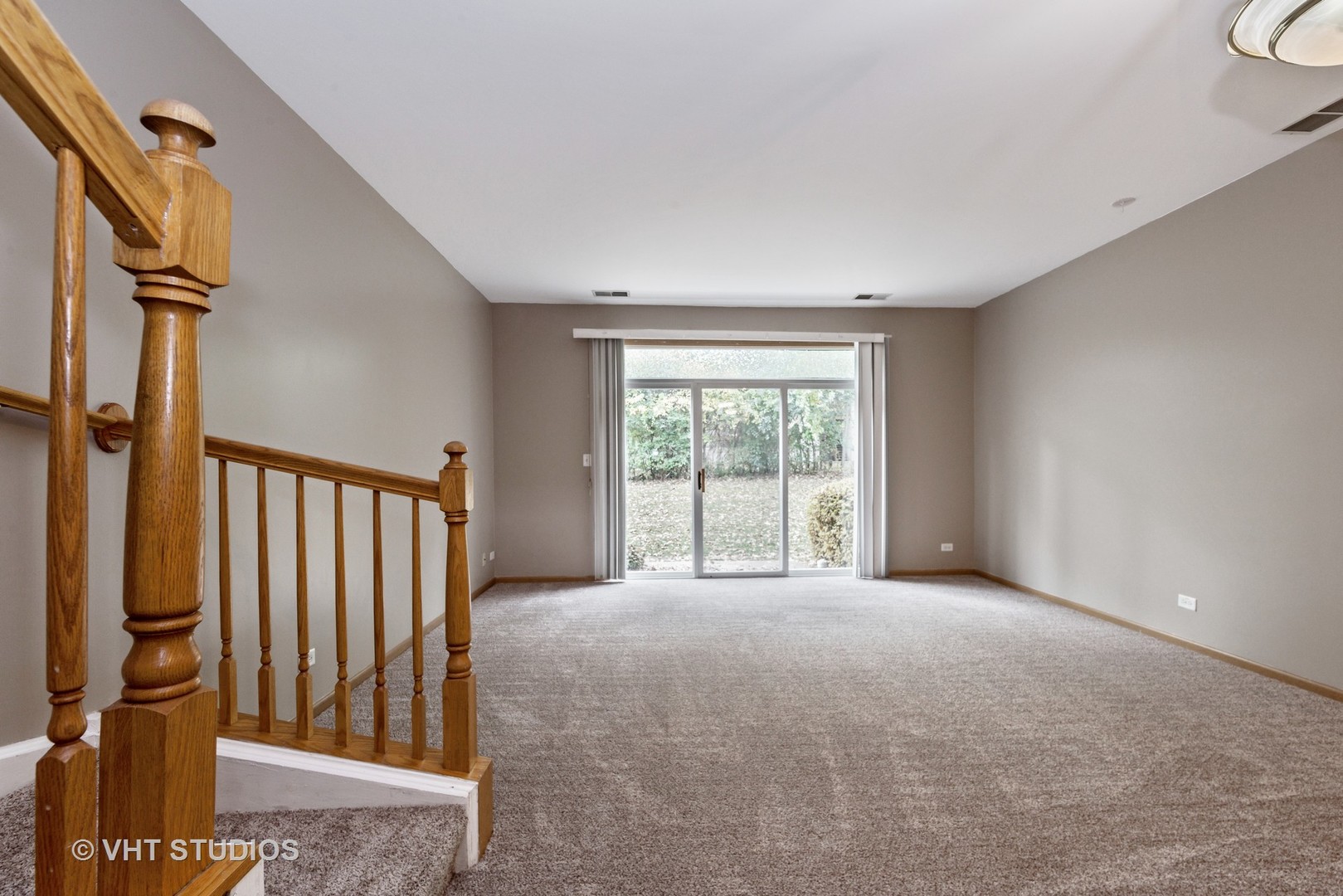 1207 Brookdale Drive Carpentersville, IL 60110 - Photo 3 of 14 a view of an empty room with a window