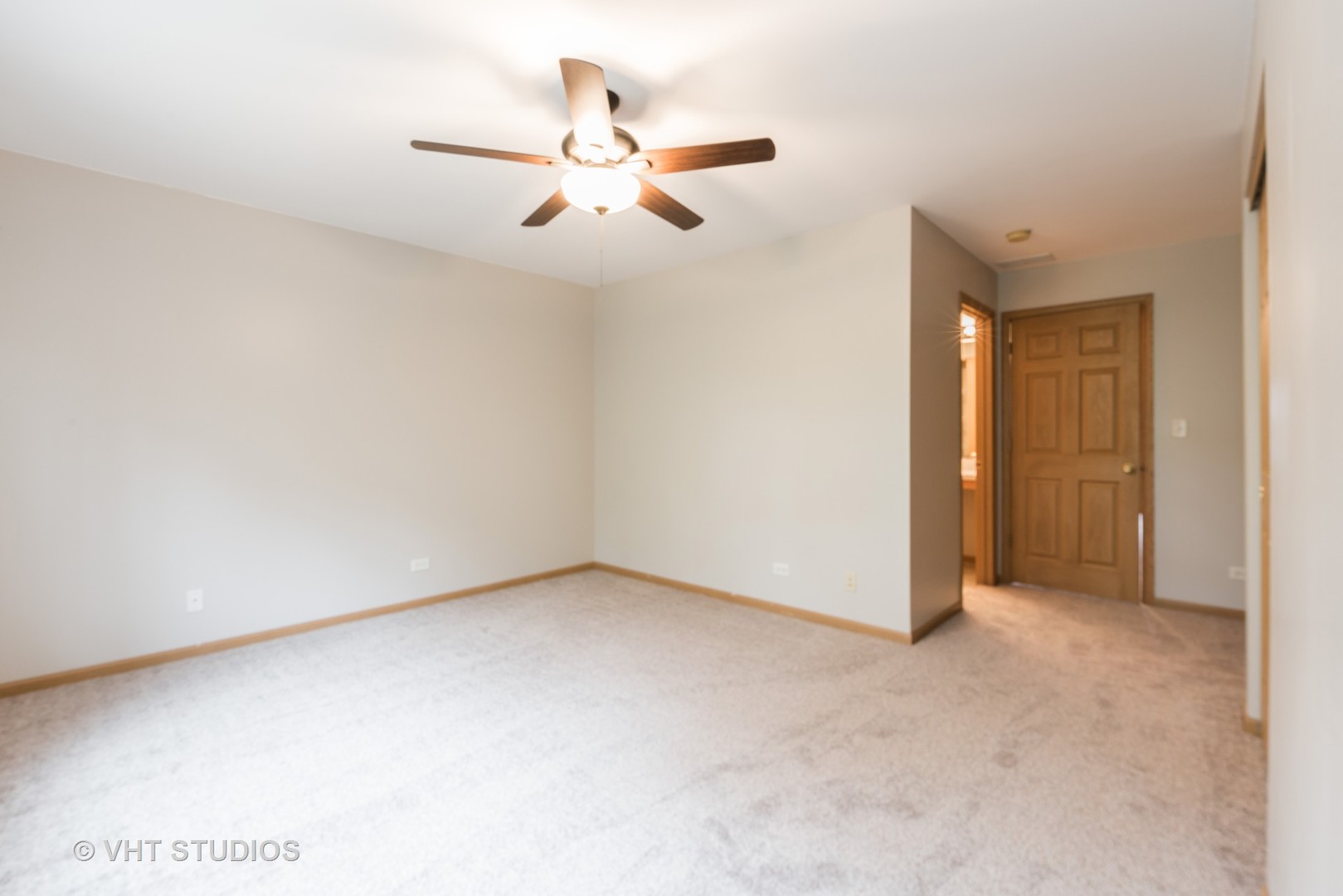 1207 Brookdale Drive Carpentersville, IL 60110 - Photo 8 of 14 an empty room with a ceiling fan and a window