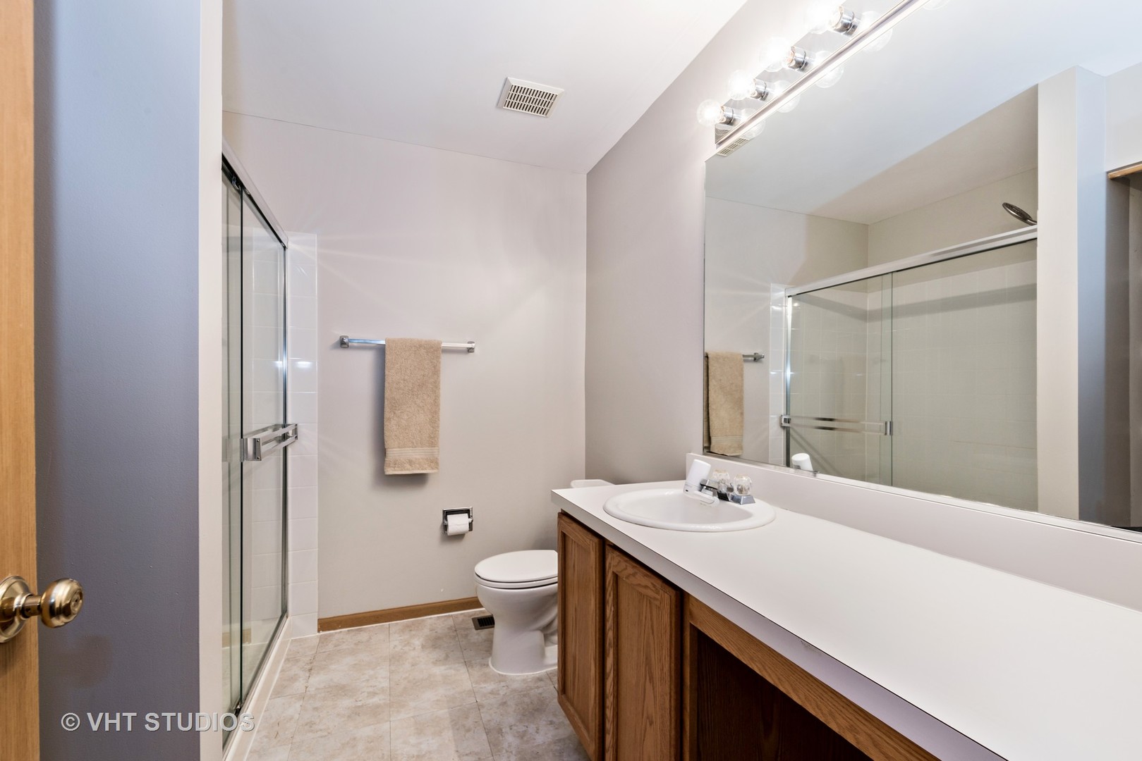 1207 Brookdale Drive Carpentersville, IL 60110 - Photo 9 of 14 a bathroom with a sink a toilet and shower