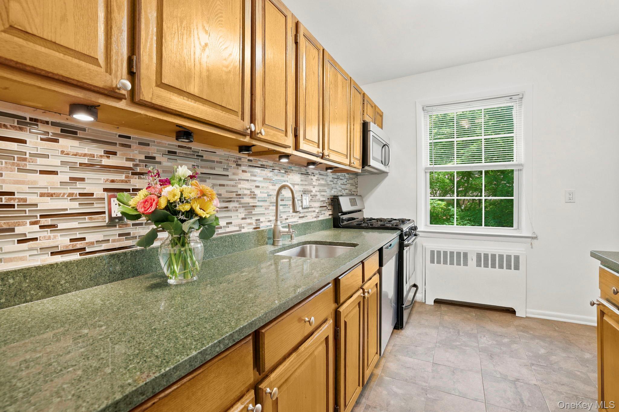 186 Pinewood Road, Unit 56 Hartsdale, NY 10530 - Photo 8 of 29 The renovated kitchen has granite countertops, undermount stainless steel sink and under cabinet lighting to create a great workspace area