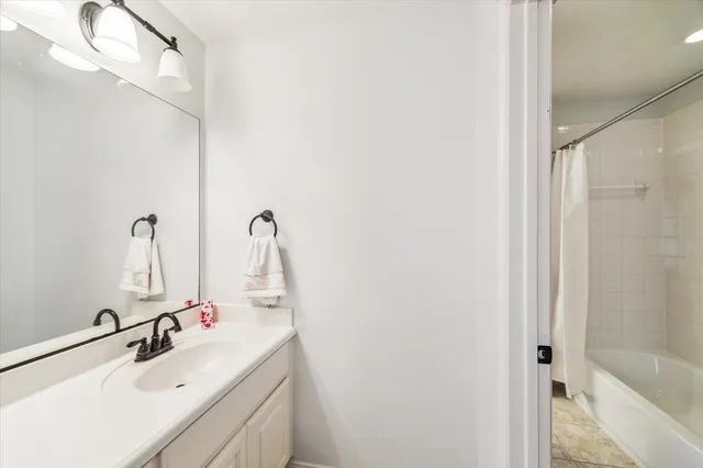 a bedroom with two beds and a window