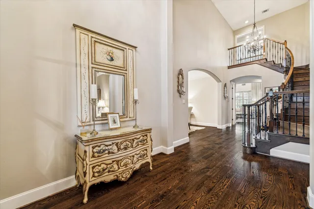 a living room with furniture and a piano