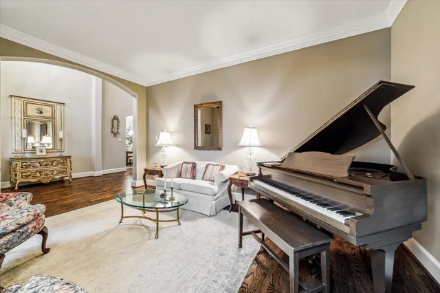 a living room with lots of furniture and baby bed