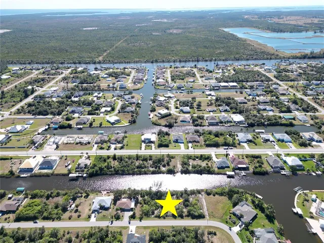 an aerial view of residential building and lake