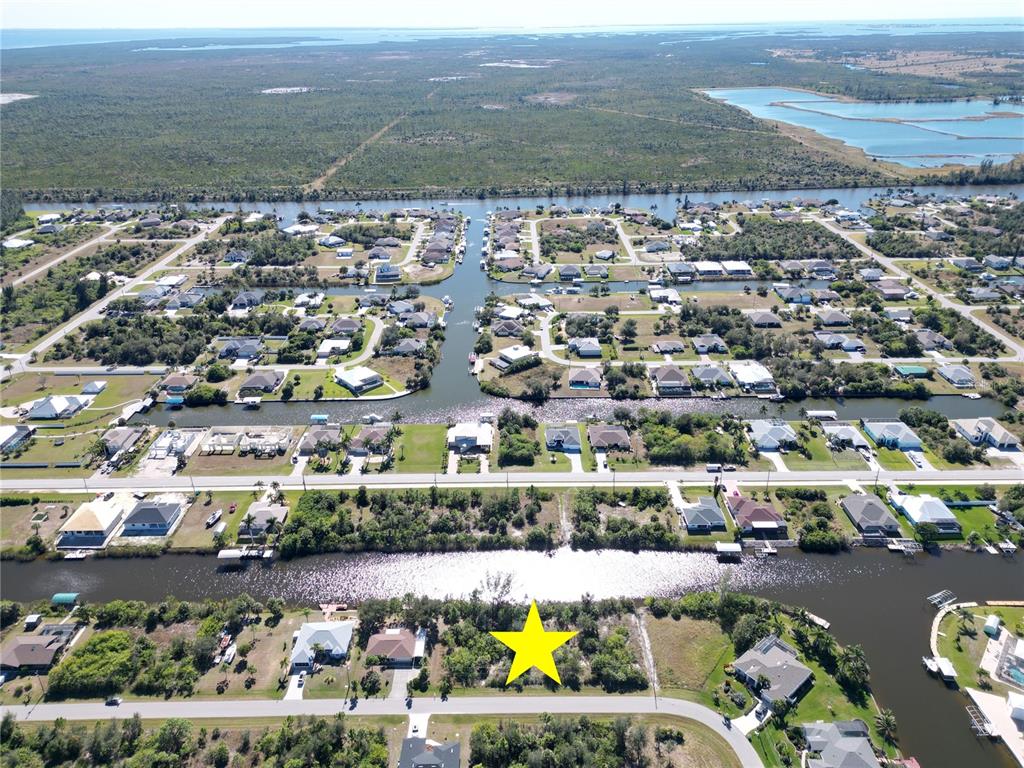15706 Stuart Circle Port Charlotte, FL 33981 - Photo 4 of 10 an aerial view of residential building and lake