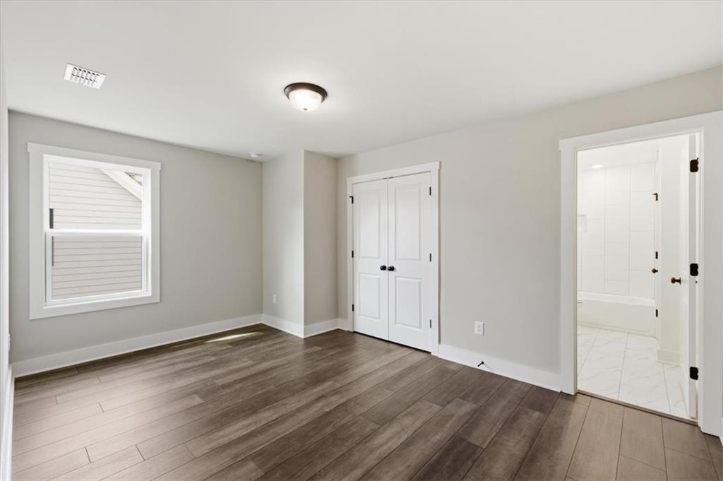 127 Old Alabama Road Southeast Emerson, GA 30137 - Photo 31 of 47 an empty room with wooden floor and windows