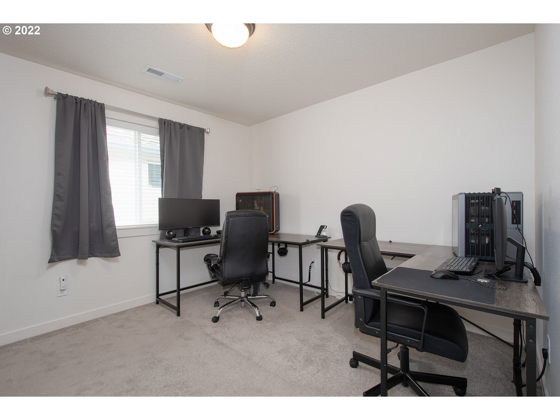 7030 South Ridge Way Ridgefield, WA 98642 - Photo 20 of 27 a view of a workspace with furniture and a window