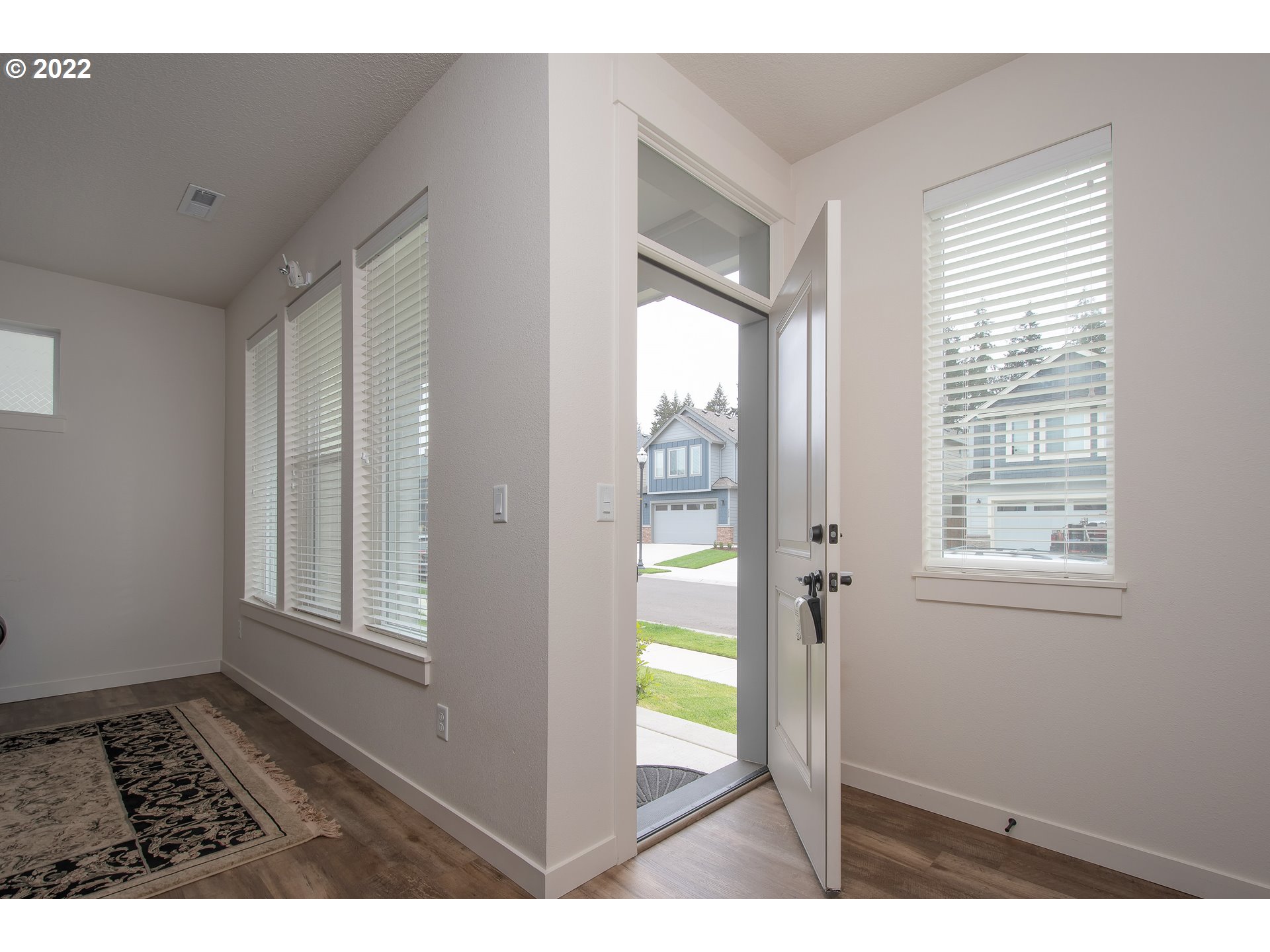7030 South Ridge Way Ridgefield, WA 98642 - Photo 3 of 27 a view of an empty room and a window