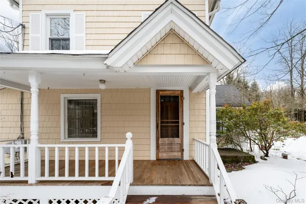 a view of a balcony with wooden floor