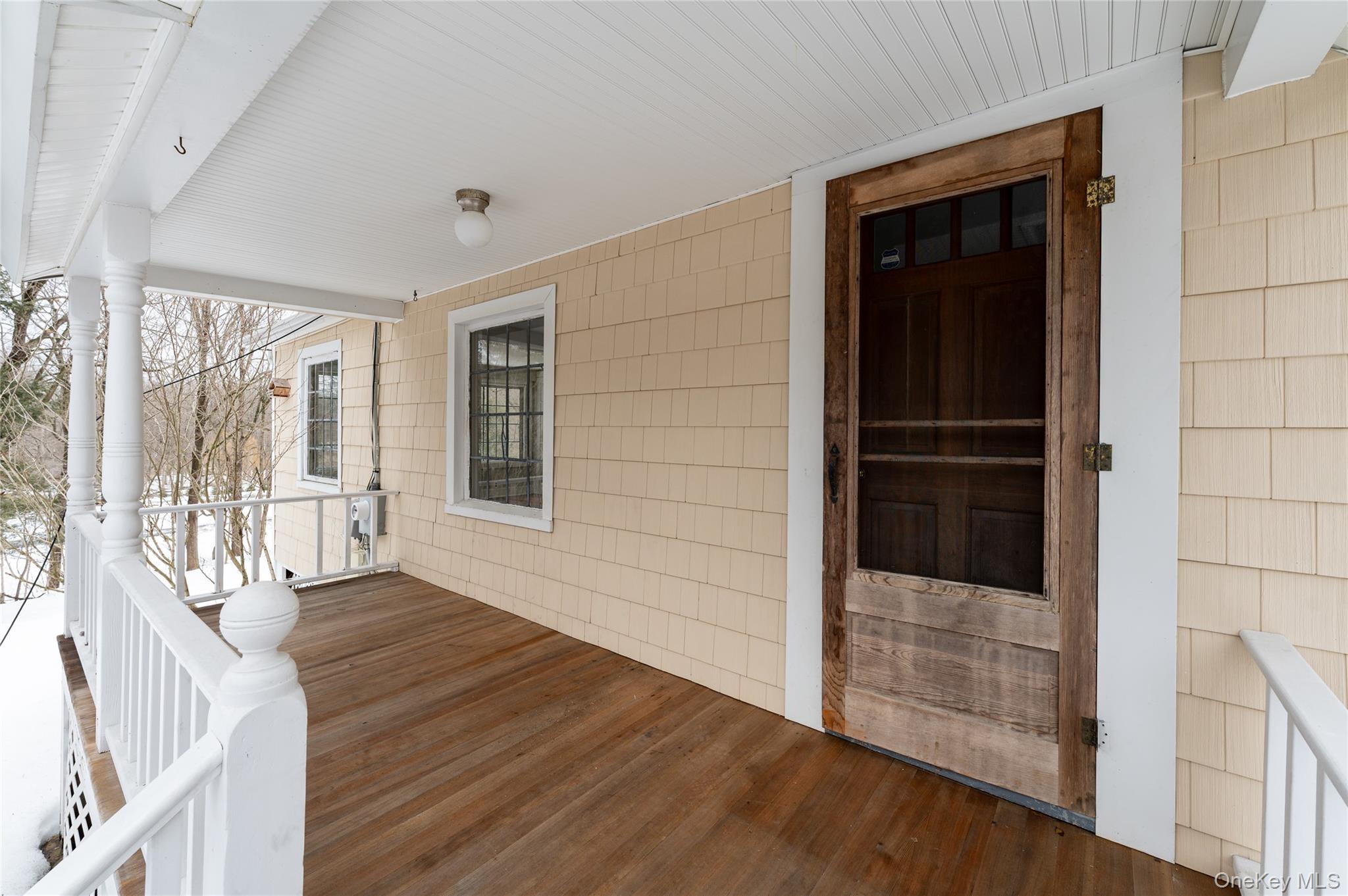 277 Old Post Road Bedford, NY 10506 - Photo 11 of 39 a view of an entryway with wooden floor and door